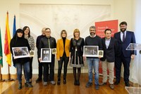 Imagen de los fotógrafos premiados y Jurado